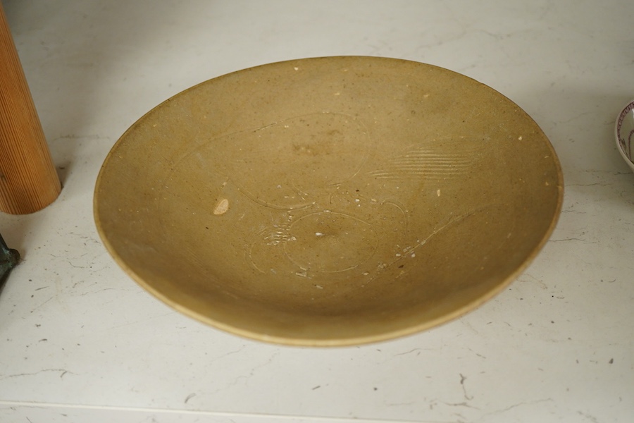 A Chinese incised celadon bowl, Song dynasty, 24cm diameter